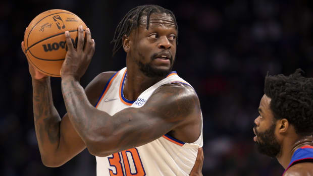 Dec 29, 2021; Detroit, Michigan, USA; New York Knicks forward Julius Randle (30) gets defended by Detroit Pistons guard Derrick Walton Jr. (25) during the second quarter at Little Caesars Arena. Mandatory Credit: Raj Mehta-USA TODAY Sports
